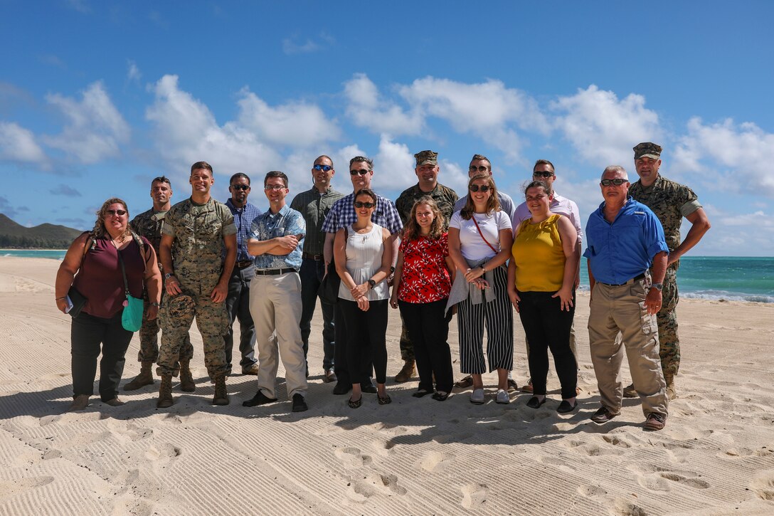 Marine Corps Base Hawaii leadership and House Appropriations, Subcommittee on Military Construction and Veterans Affairs Legislative Assistants pose for a group photo during a tour of Marine Corps Training Area Bellows, Aug. 21, 2019.