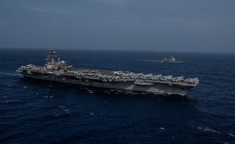 PHILIPPINE SEA (August 15, 2019) The Navy’s forward-deployed aircraft carrier USS Ronald Reagan (CVN 76) sails alongside the Japan Maritime Self-Defense Force guided-missile destroyer JS Myoko (DDG-175) while underway. The Navy and JMSDF regularly operate, train and exercise together to improve interoperability and strengthen joint capabilities. Ronald Reagan, the flagship of Carrier Strike Group 5, provides a combat-ready force that protects and defends the collective maritime interests of its allies and partners in the Indo-Pacific region.
