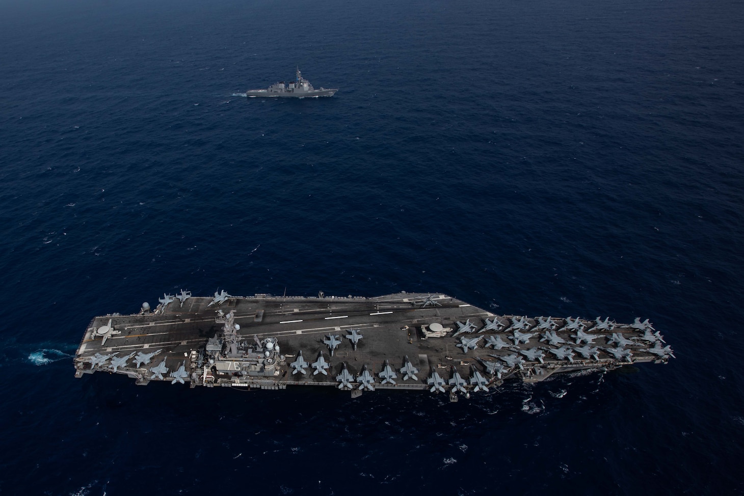 PHILIPPINE SEA (August 15, 2019) The Navy’s forward-deployed aircraft carrier USS Ronald Reagan (CVN 76) sails alongside the Japan Maritime Self-Defense Force guided-missile destroyer JS Myoko (DDG-175) while underway. The Navy and JMSDF regularly operate, train and exercise together to improve interoperability and strengthen joint capabilities. Ronald Reagan, the flagship of Carrier Strike Group 5, provides a combat-ready force that protects and defends the collective maritime interests of its allies and partners in the Indo-Pacific region.
