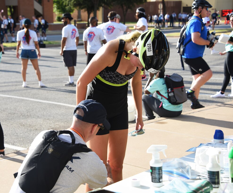 Sheppard Air Force Base 82nd Medical Group personnel provide care to an injured  Hotter‘N Hell Hundred cyclist