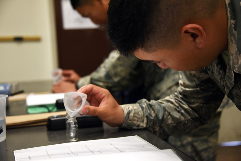 366th Training Squadron water and fuels systems maintenance course student, conducts a chlorine test