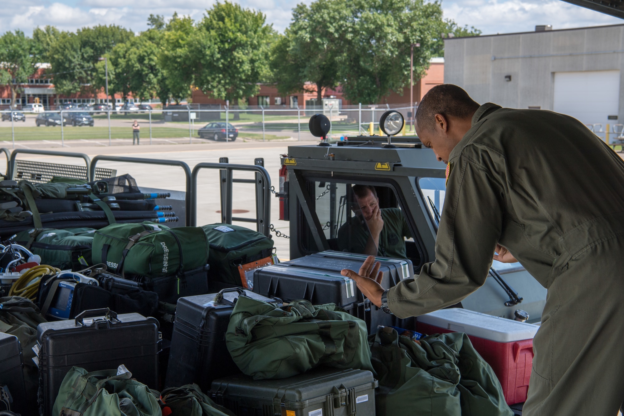 Staff Sgt. Andre A. Phillip, 732nd Airlift Squadron, loadmaster with the 514th Air Mobility Wing, Joint Base McGuire-Dix-Lakehurst, N.J., guides a member from the 934th Logistics Readiness Squadron, Minneapolis-St Paul Air Reserve Station, Minn., who is driving a Halvorsen loader up to the ramp of a C-17 Globemaster III to load cargo and equipment of Reserve Citizen Airmen returning to their home stations following the completion of Patriot Warrior 2019 in Minneapolis-St Paul Air Reserve Station, Minn., August 24, 2019. Members of the 732nd AS and 514th Aeromedical Evacuation Squadron cooperated with various squadrons across the U.S. Air Force Reserve including the 934th LRS, the 439th AES, and the 914th AES, as well as the United Kingdom’s Royal Air Force. Patriot Warrior is the Air Force Reserve Command’s premier exercise, providing an opportunity for Reserve Citizen Airmen to train with joint and international partners in airlift, aeromedical evacuation and mobility support.