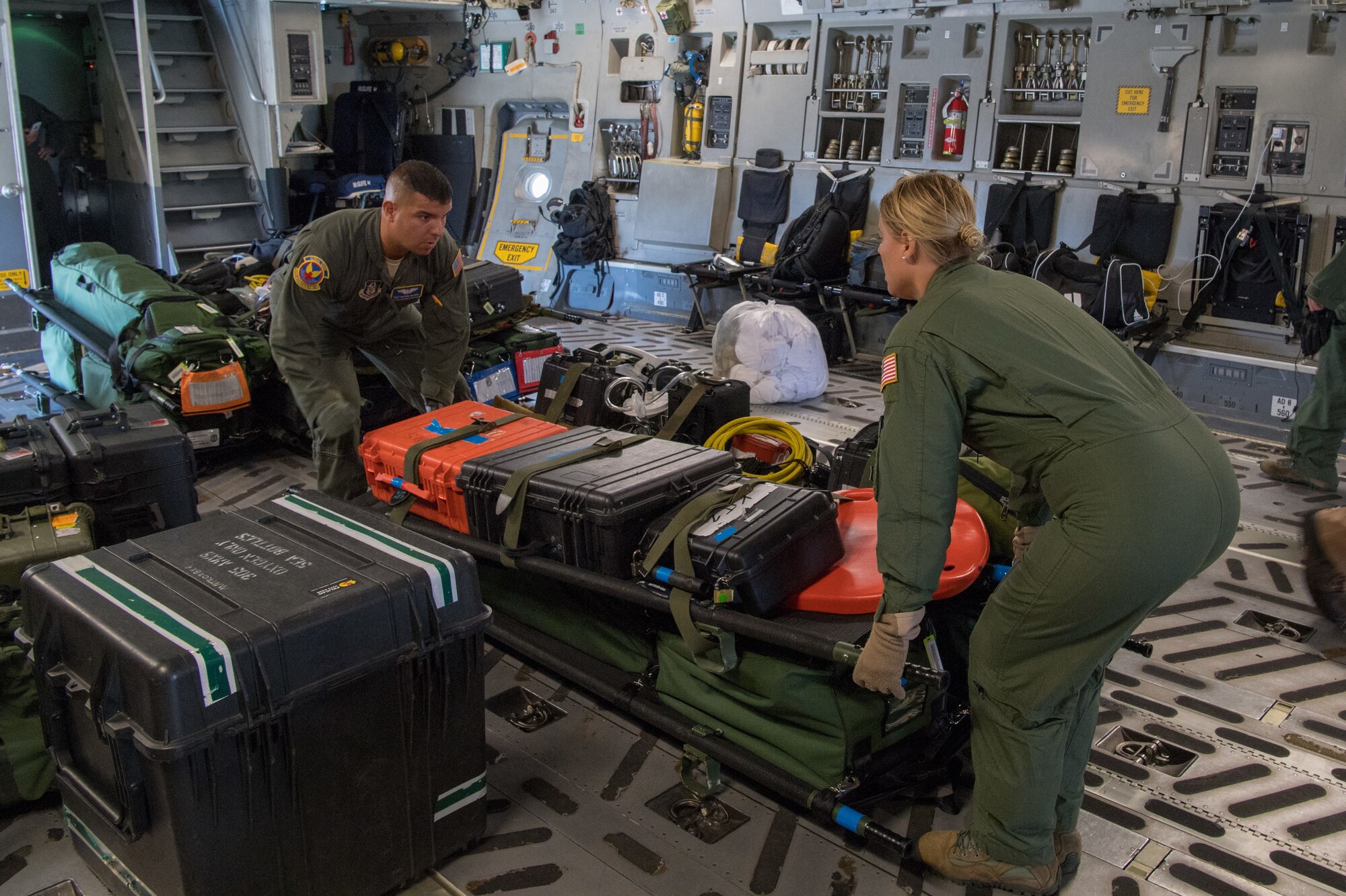 Tech. Sgt. Darwin Najera, and Staff Sgt. Suzanne Milligan both medical technicians with the 439th Aeromedical Evacuation Squadron, Westover Air Reserve Base, Mass., load cargo and equipment on a C-17 Globemaster III following the completion of Patriot Warrior 2019 in Minneapolis-St Paul Air Reserve Station, Minn., August 24, 2019. Members of the 732nd Airlift Squadron and 514th AES cooperated with various squadrons across the U.S. Air Force Reserve including the 934th Logistics Readiness Squadron, the 439th AES, and the 914th AES, as well as the United Kingdom’s Royal Air Force. Patriot Warrior is the Air Force Reserve Command’s premier exercise, providing an opportunity for Reserve Citizen Airmen to train with joint and international partners in airlift, aeromedical evacuation and mobility support.