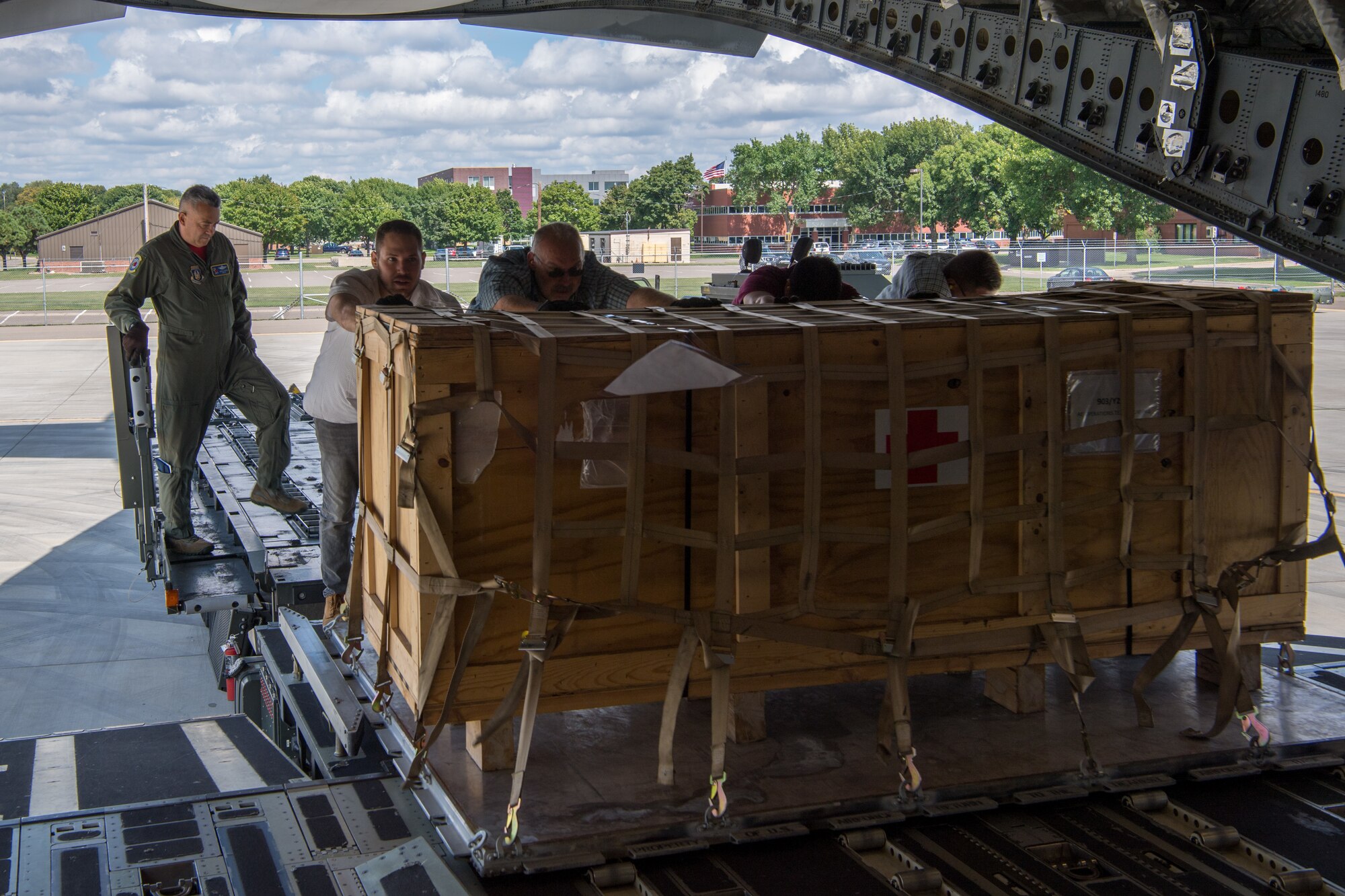 Chief Master Sgt. Juan Claudio, 732nd Airlift Squadron, loadmaster with the 514th Air Mobility Wing, Joint Base McGuire-Dix-Lakehurst, N.J., and members from the 934th Logistics Readiness Squadron, Minneapolis-St Paul Air Reserve Station, Minn., load a pallet of supplies onto a C-17 Globemaster III following the completion of Patriot Warrior 2019 in Minneapolis-St Paul Air Reserve Station, Minn., August 24, 2019. Members of the 732nd AS and 514th Aeromedical Evacuation Squadron cooperated with various squadrons across the U.S. Air Force Reserve including the 934th LRS, the 439th AES, and the 914th AES, as well as the United Kingdom’s Royal Air Force. Patriot Warrior is the Air Force Reserve Command’s premier exercise, providing an opportunity for Reserve Citizen Airmen to train with joint and international partners in airlift, aeromedical evacuation and mobility support.