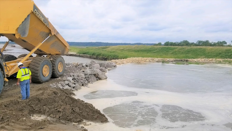 USACE Omaha District contractors perform an initial breach closure at levee L550 near Watson, Missouri Aug. 24, 2019.