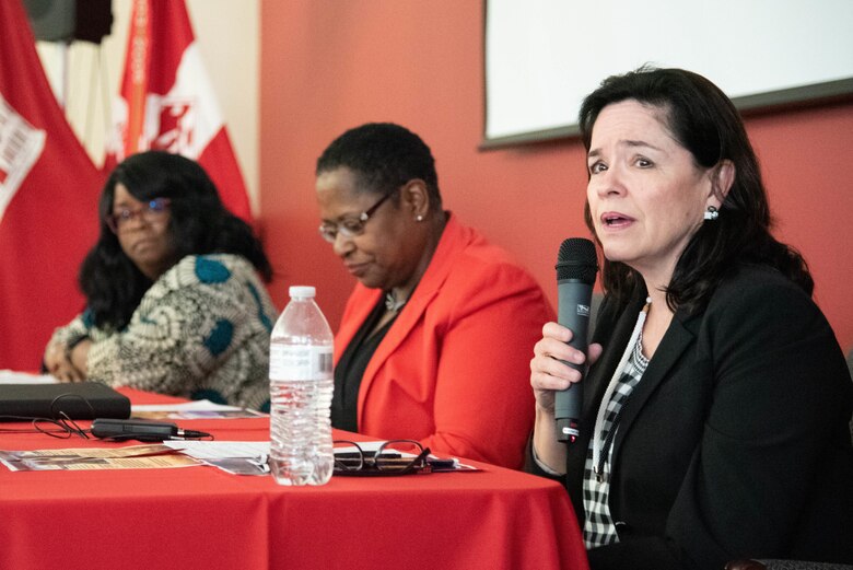 Karen Pane, director of Human Resources for the U.S. Army Corps of Engineers, speaks during a Women’s Equality Day discussion panel at the U.S. Army Engineering and Support Center, Huntsville, Alabama, Aug. 22, 2019. Sitting at center is Dr. Juanita M. Christensen, executive director of the U.S. Army Combat Capabilities Development Command Aviation and Missile Center. At far left is Audrey Robinson, Esq., chief of counsel at NASA's Marshall Space Flight Center.