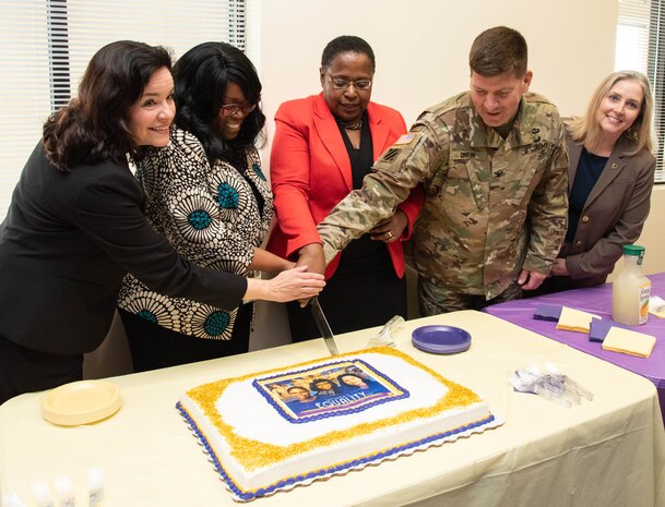 Dr. Juanita M. Christensen, executive director of the U.S. Army Combat Capabilities Development Command’s Aviation and Missile Center, joins fellow leaders for a cake-cutting ceremony to commemorate Women's Equality Day Aug. 22, 2019, at the U.S. Army Engineering and Support Center, Huntsville, Alabama. Christensen, who served on a discussion panel as part of Huntsville Center's celebration, in the photo is joined by (from left to right) Karen Pane, director of Human Resources for the U.S. Army Corps of Engineers; Audrey Robinson, Esq., chief of counsel at NASA's Marshall Space Flight Center; Col. Marvin Griffin, Huntsville Center commander; and Christina Freese, Huntsville Center business director.