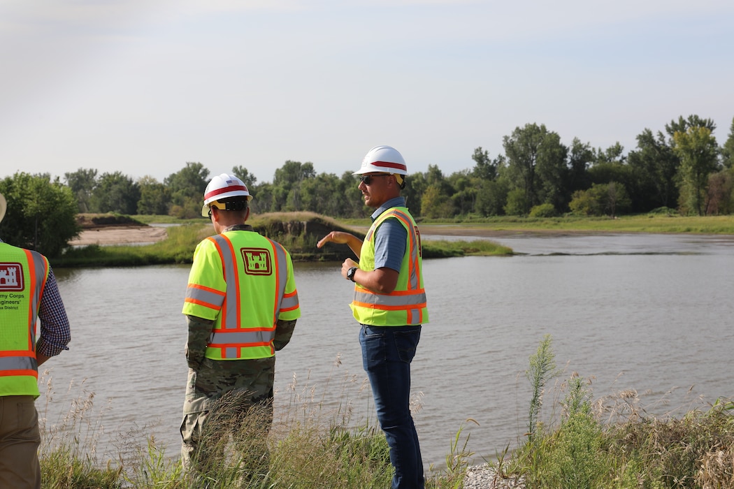 Col. John Hudson and USACE Omaha District employees review progress on Levee L611-614 near Council Bluffs, Iowa Aug. 23, 2019.