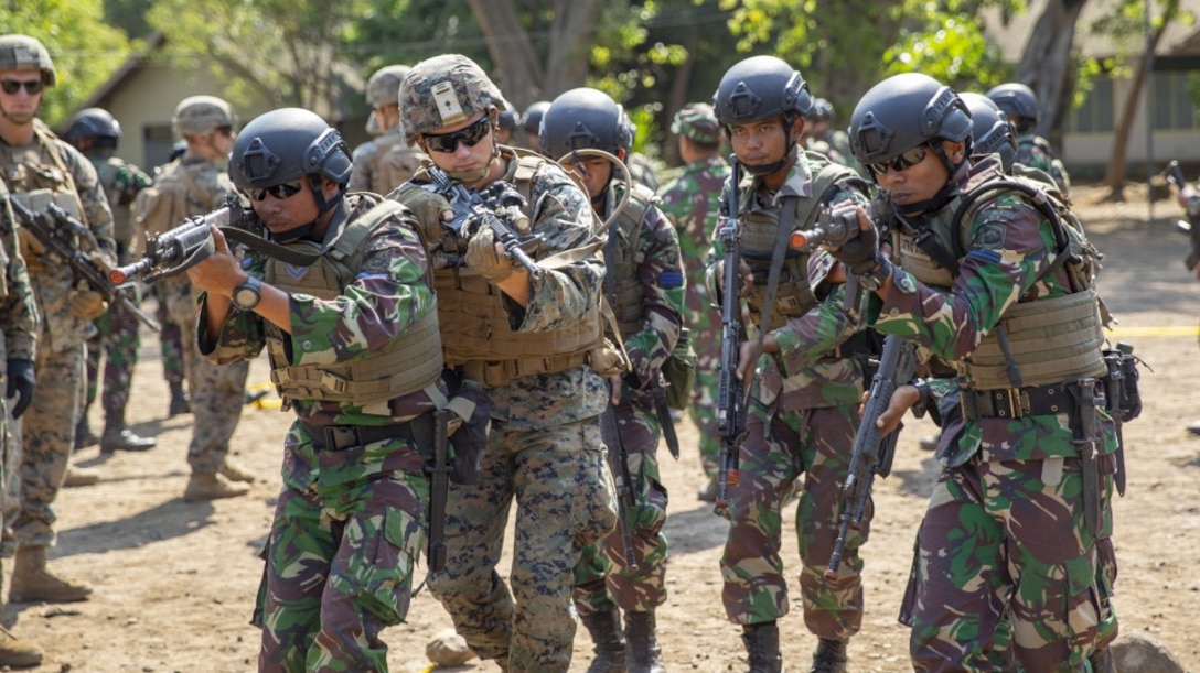 U.S. Marines with Alpha Company, 1st Battalion, 3rd Marine Regiment conduct MOUT training with Indonesian Marines during the Korps Marinir (KORMAR) Platoon Exchange 2019 program in Surabaya, Indonesia, August 9, 2019. The KORMAR platoon exchange program between Indonesia and the U.S. involves each country sending a platoon of Marines to live and train together at the other's military base. This program enhances the capability of both services and displays their continued commitment to share information and increase the ability to respond to crisis together. (U.S. Marine corps photo by Cpl. Eric Tso)