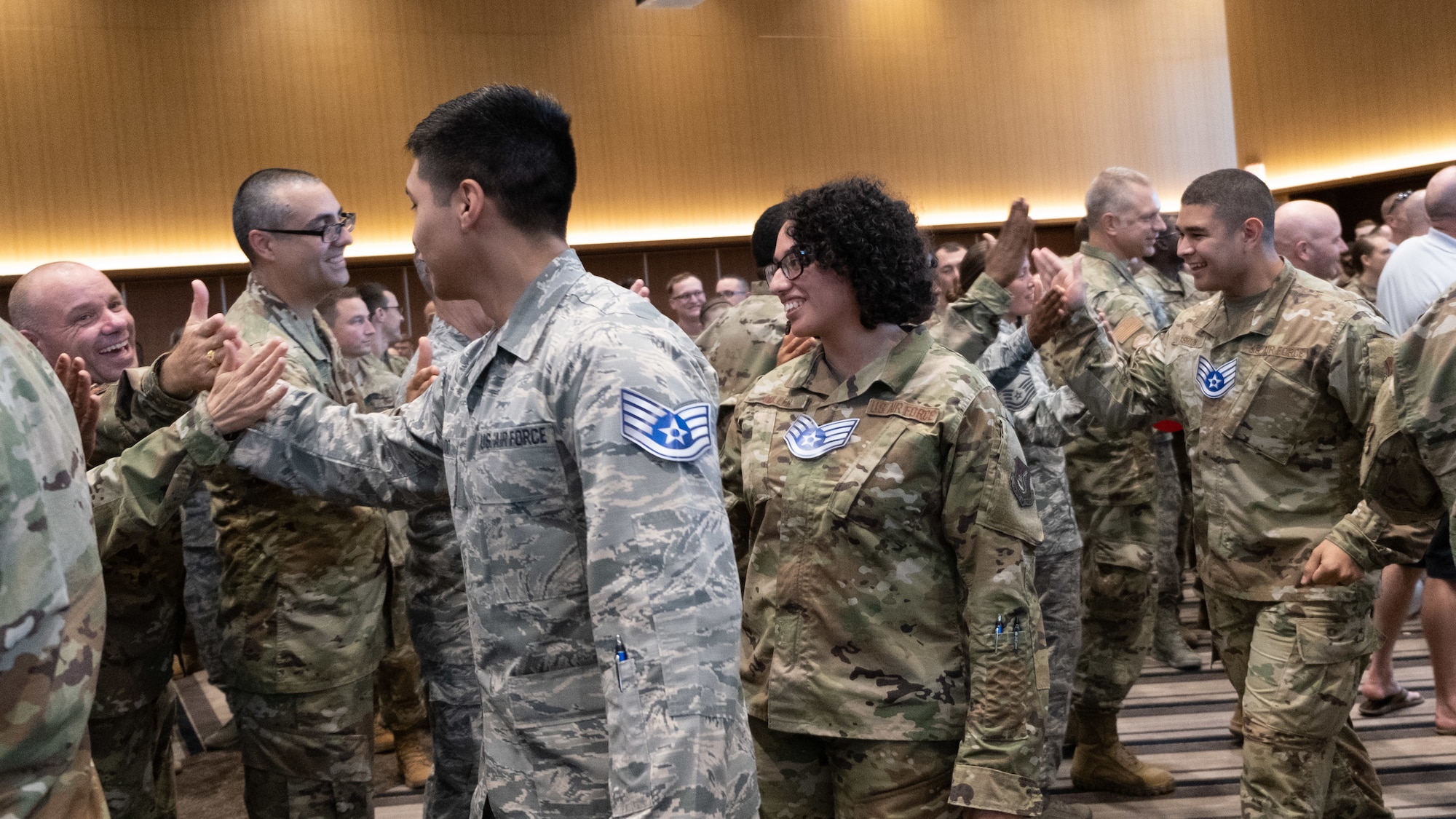 The Kadena Shoguns celebrate their newest staff sergeant selects during a celebration at Kadena Air Base, Japan, Aug. 23, 2019. Across the 18th Wing, 380 senior airmen were selected for promotion to staff sergeant. (U.S. Air Force photo by Staff Sgt. Benjamin Raughton)