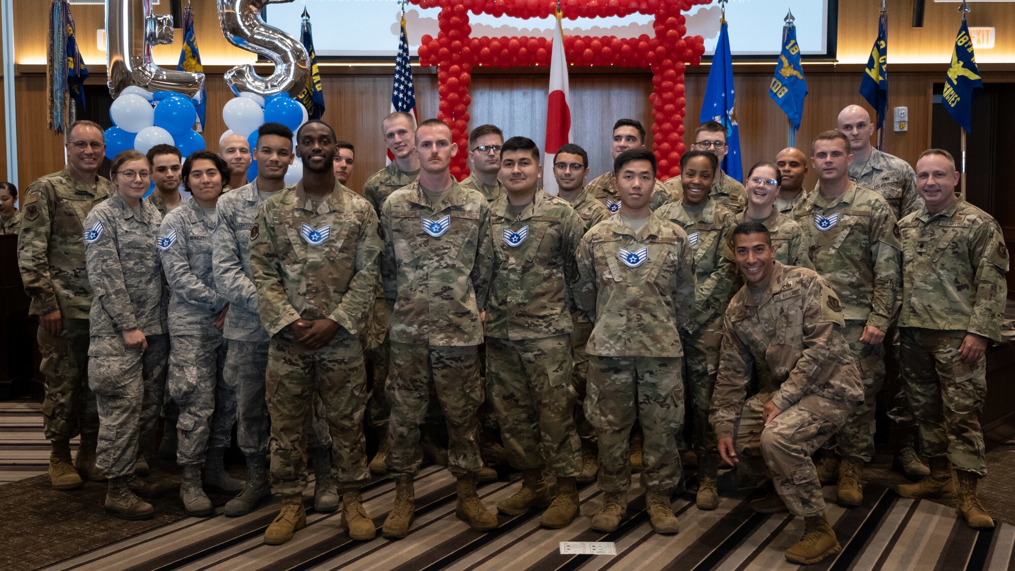 The Kadena Shoguns celebrate their newest staff sergeant selects during a celebration at Kadena Air Base, Japan, Aug. 23, 2019. Across the 18th Wing, 380 senior airmen were selected for promotion to staff sergeant. (U.S. Air Force photo by Staff Sgt. Benjamin Raughton)