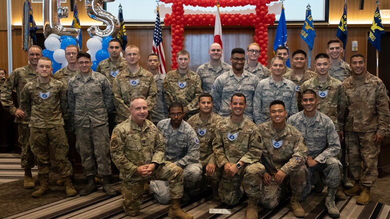 The Kadena Shoguns celebrate their newest staff sergeant selects during a celebration at Kadena Air Base, Japan, Aug. 23, 2019. Across the 18th Wing, 380 senior airmen were selected for promotion to staff sergeant. (U.S. Air Force photo by Staff Sgt. Benjamin Raughton)