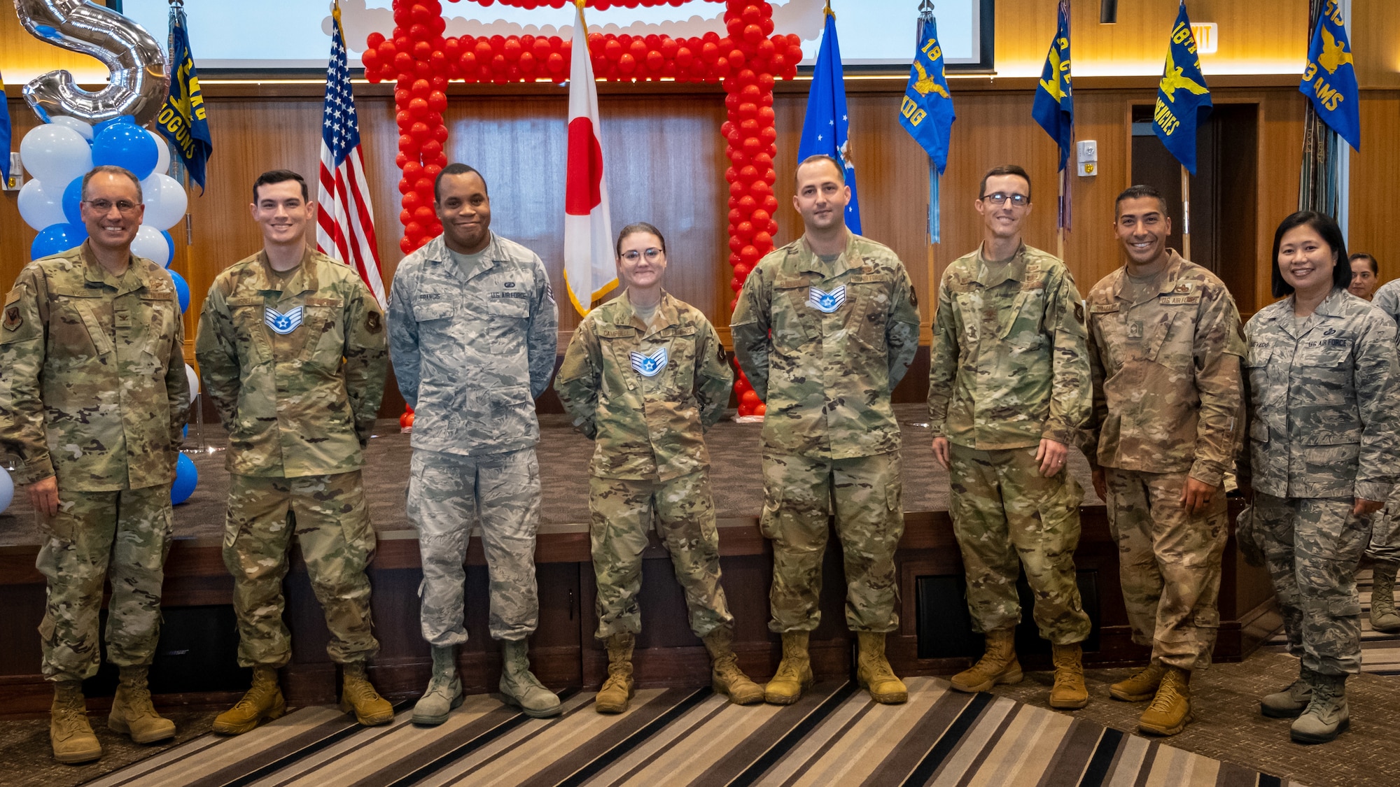 The Kadena Shoguns celebrate their newest staff sergeant selects during a celebration at Kadena Air Base, Japan, Aug. 23, 2019. Across the 18th Wing, 380 senior airmen were selected for promotion to staff sergeant. (U.S. Air Force photo by Staff Sgt. Benjamin Raughton)