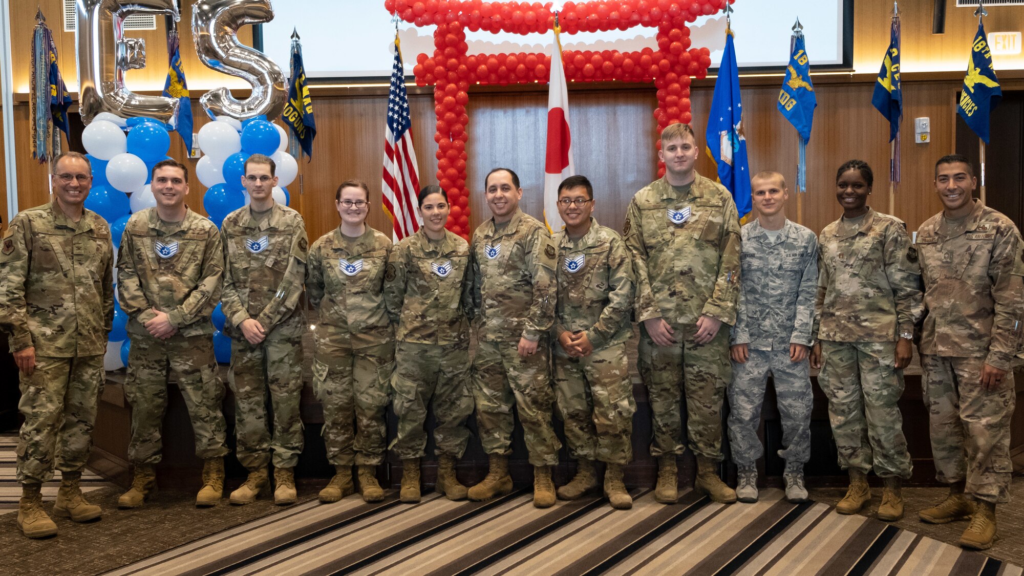 The Kadena Shoguns celebrate their newest staff sergeant selects during a celebration at Kadena Air Base, Japan, Aug. 23, 2019. Across the 18th Wing, 380 senior airmen were selected for promotion to staff sergeant. (U.S. Air Force photo by Staff Sgt. Benjamin Raughton)