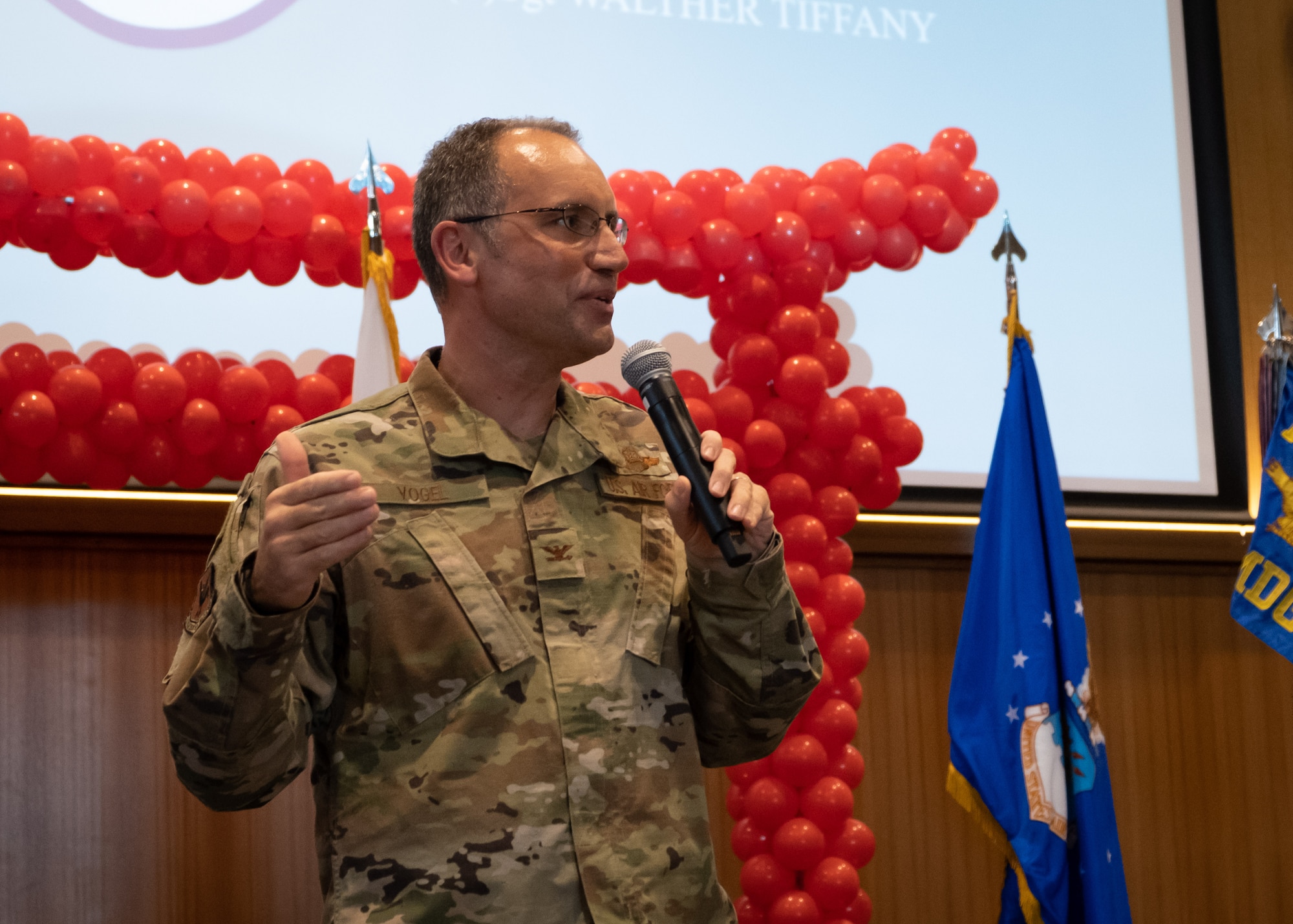 Col. George Vogel, 18th Wing Vice Commander, addresses the crowd as the Kadena Shoguns celebrate their newest staff sergeant selects during a celebration at Kadena Air Base, Japan, Aug. 23, 2019.