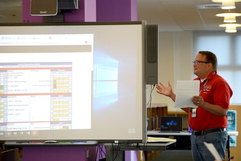Andrew Gann, principle of Aviano Elementary School, discusses the new school year with teachers and administration, Aug. 19, 2019, at Aviano Air Base, Italy. Gann says watching the students flourish and being a part of their journey to citizens of the 21st century is a privilege. (U.S. Air Force photo by Airman 1st Class Ericka A. Woolever)