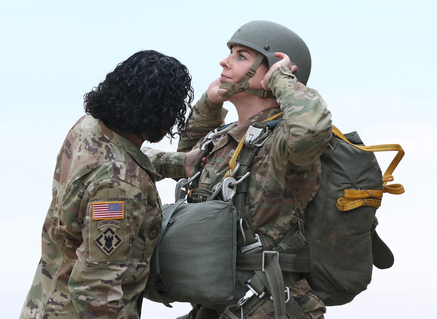 Master Sgt. Jessica Alicea-Cavezza (right), Sexual Harassment Assault Response Prevention Program Manager conducts a jumpmaster pre-inspection with Sgt. Allyson Westfall, parachute rigger, both from the U.S. Army John F. Kennedy Special Warfare Center and School, prior to an airborne operation over Luzon Drop Zone at Camp Mackall, North Carolina, March 25, 2019. The Soldiers completed an all-women’s pass and performed the jump in celebration of Women’s History Month, which has been celebrated in the United States since 1987, and highlighted contributions of women to U.S. Army history and society.