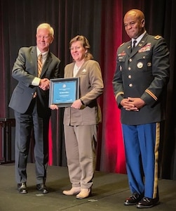 Martha Wilkins (center), Emergency Preparedness Liaison Officer, U.S. Army North, was recognized as one of the 2019 Joint Women’s Meritorious Service Award recipients, at the Joint Women's Leadership Symposium  held in Washington D.C., Aug. 23. The 32nd Annual symposium, which is the largest gathering of women in uniform in the nation, brings together women serving in the Department of Defense and Coast Guard including civilians, officers, enlisted and cadets. JWLS has become a crucial component in the professional growth and development of women in our Armed Forces.