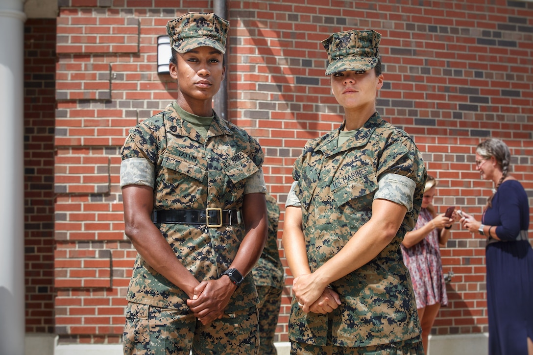 Staff Sgt. Ebony Tatum and 2nd Lt. Christina Valentine pose for a photo at Marine Corps Officer Candidates School on Marine Corps Base Quantico, Viriginia, August 10, 2019. Tatum, a native of Fort Washington, Maryland, previously served as a drill instructor at Marine Corps Recruit Depot Parris Island, South Carolina where she trained Valentine to become a United States Marine in 2016. Valentine, a native of Dallas, Texas, took advantage of the Marine Corps' Enlisted Commissioning Program, which allows enlisted Marines who have already completed their bachelor's degree to become Marine Corps Officers. The two Marines reunited at Officer Candidates School, where Valentine was an officer candidate and Tatum was her sergeant instructor. During the ten weeks of Officer Candidates Course, officer candidates are evaluated daily by their sergeant instructors for their performance and how well they are developing leadership, moral, mental, and physical qualities required for commissioning as a Marine Corps Officer.