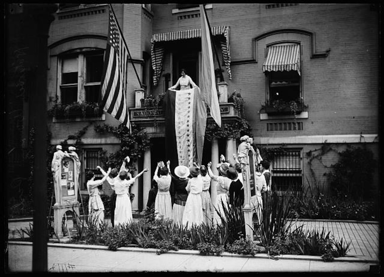 Alice Paul, National Woman's Party chair, unfurled the ratification banner at the NWP headquarters in Washington, D.C., following the Nineteenth Amendment's ratification.