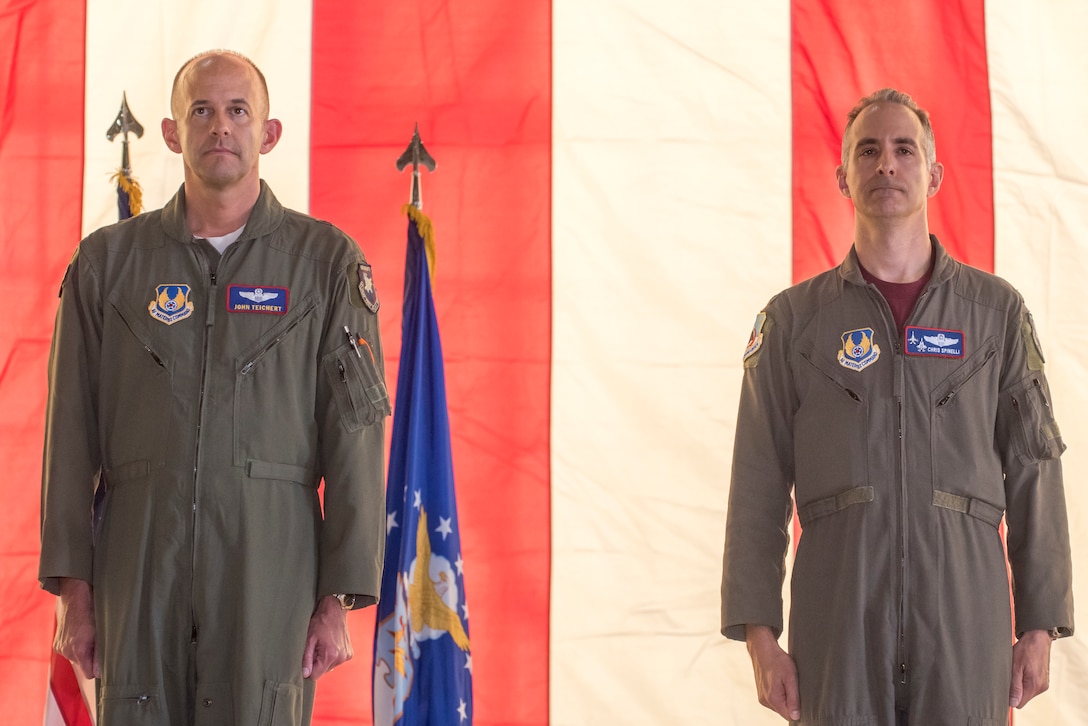 Col. Christopher J. Spinelli and Brig. Gen. E. John "Dragon" Teichert stand side-by-side during change of command ceremony