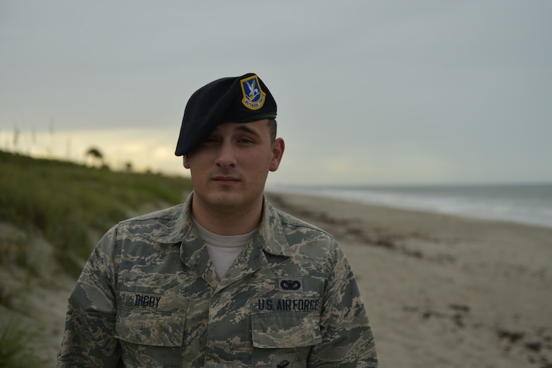 Airman 1st Class Tyler Digby, 45th Security Forces Squadron, installation entry controller, poses for a photo on the beaches at Patrick AFB, Fla., August 7, 2019. Digby was recently awarded the Medal of Valor at the Melbourne Regional Chamber Valor Awards. (U.S. Air Force photo by Airman 1st Class Dalton Williams)