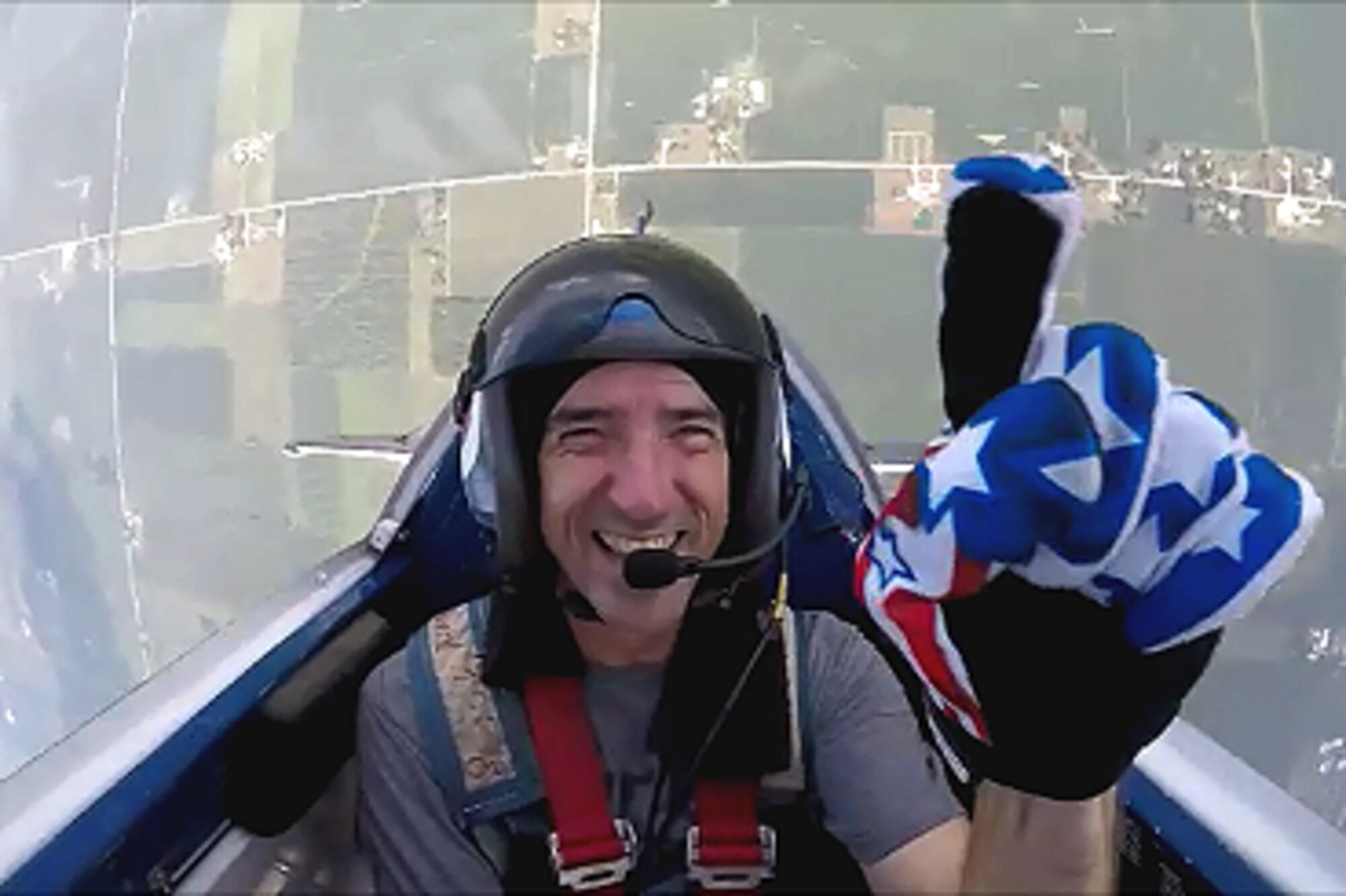 Lt. Col. Billy Werth, 434th Air Refueling Wing pilot and civilian stunt pilot, smiles into the camera as he performs stunt maneuvers in his civilian aircraft.  Werth is one of several acts scheduled to perform at the Grissom Air & Space Expo Sept. 7-8, 2019. (Courtsey photo)