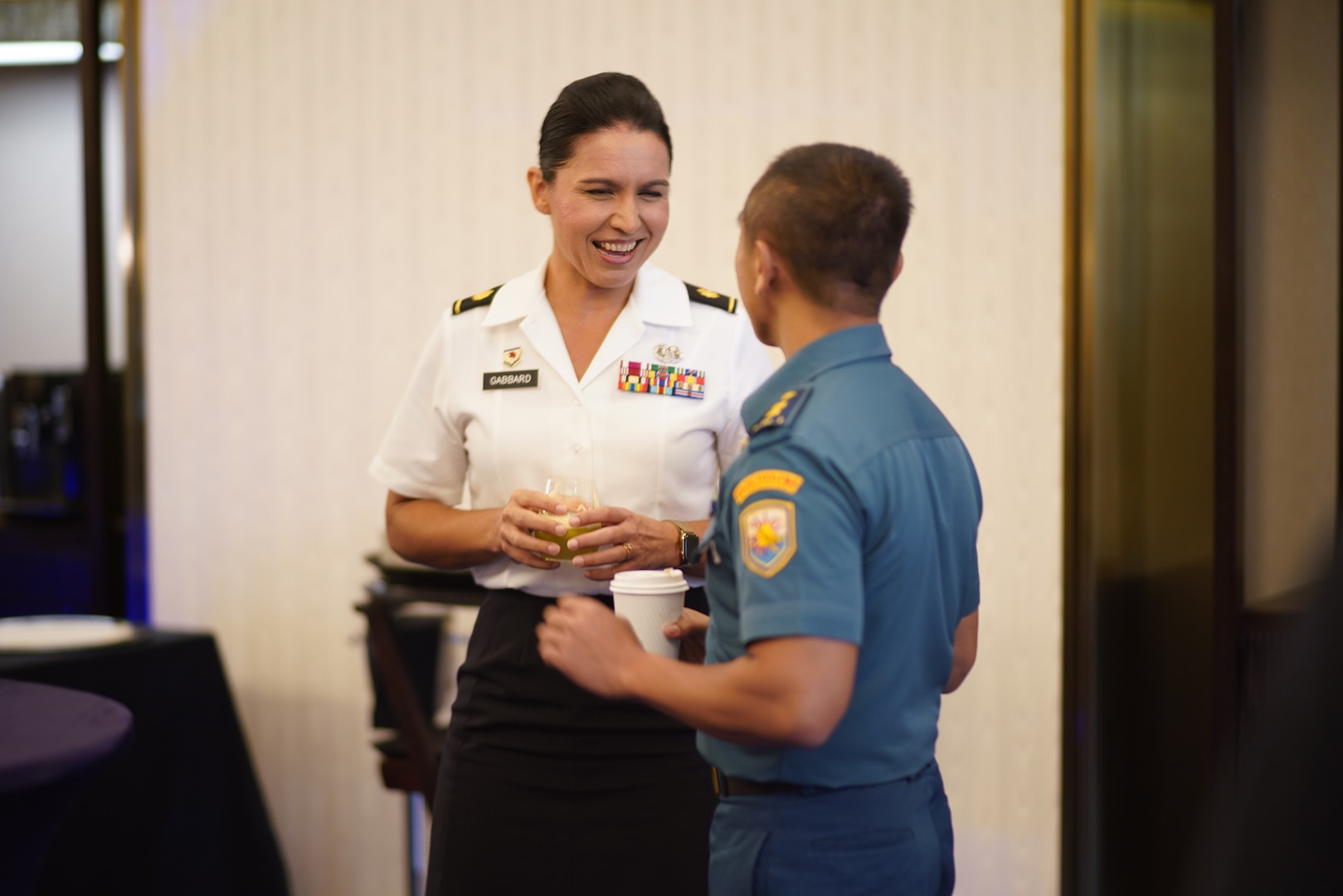 Maj. Tulsi Gabbard, Hawaii Army National Guard military police officer, reviews the operation design process with a Tentara Nasional Indonesia officer during a group breakout in Jakarta, Indonesia, Aug. 19, 2019.