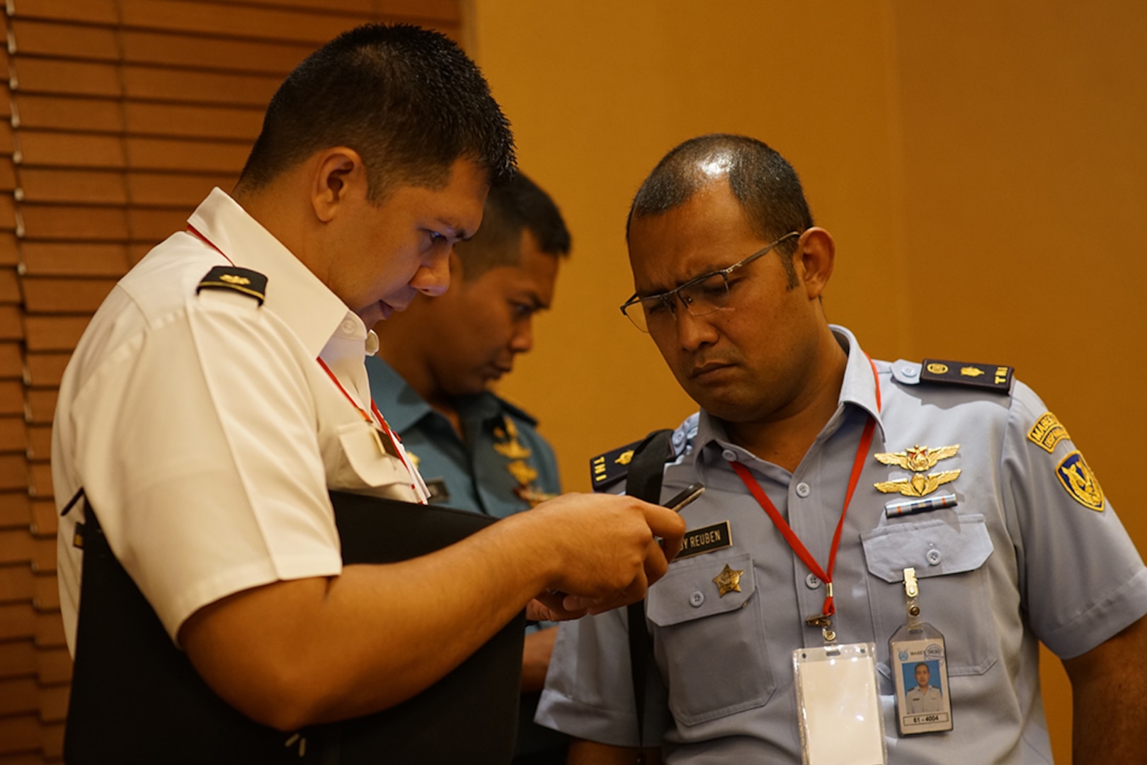 Hawaii Army National Guard Maj. Isaac Floyd and Tentara Nasional Indonesia Maj. Boby Ruben review the battle rhythm of the next phase of Gema Bhakti before moving to the planning cell, Aug. 18, 2018, Jakarta Indonesia. Gema Bhakti is a joint force multi-national staff exercise where military staff from the U.S. Indo-Pacific Command and Indonesia work through a process known as the military decision making process.