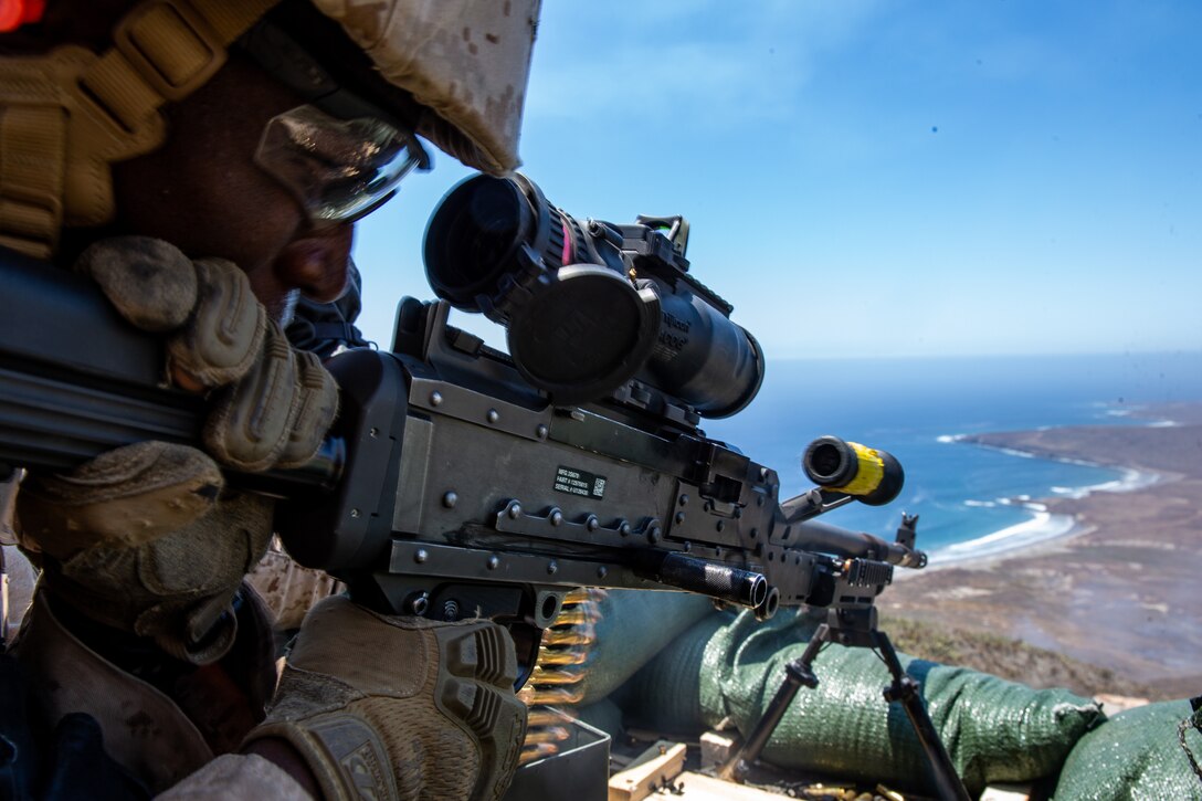 U.S. Marine Corps Lance Cpl. Dontaye Payton, an ammunition technician assigned to 1st Air Naval Gunfire Liaison Company, I Marine Expeditionary Force Information Group, fires an M240B machine gun during a live-fire range as a part of a field exercise on San Clemente Island, California, July 26, 2019. 1st ANGLICO participated in a field exercise to train to serve as a forward observer and liaison to orchestrate fire support during interagency, interservice and coalition operations.