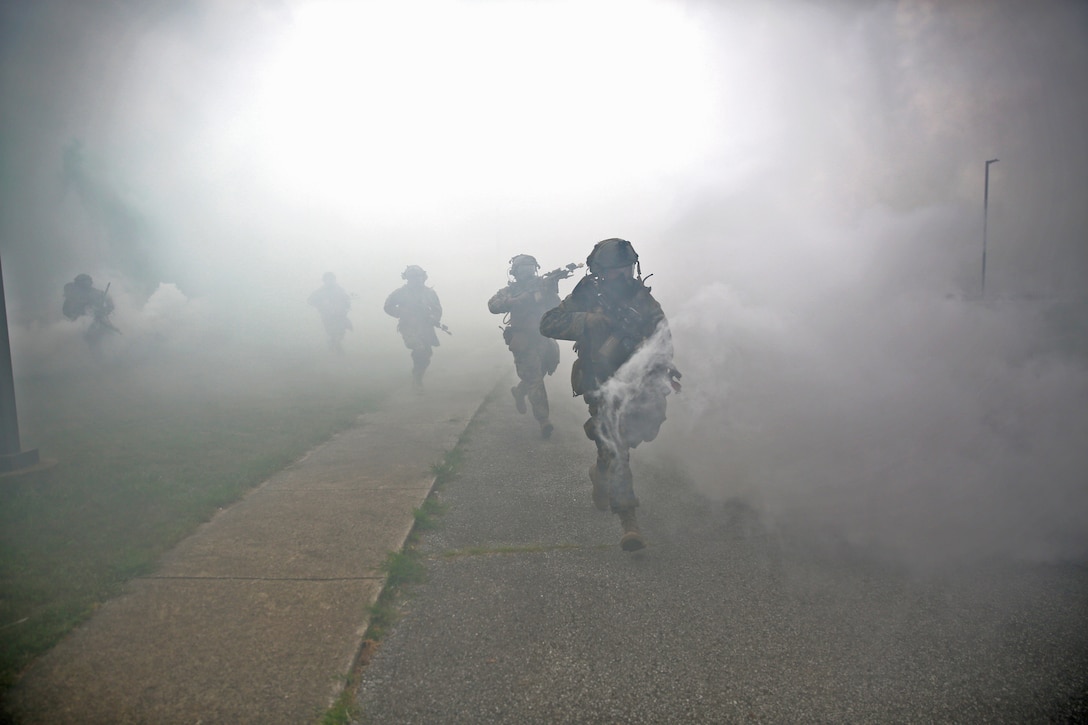 The Marine Corps Warfighting Laboratory executed Project Metropolis II ,a Dense Urban Operations limited operational experiment 2019 (DUO19) at Muscatatuck Urban Training Center, Indiana. The event aimed to effectively combine robotics, sensors, manned/unmanned vehicles, and dismounted Marines with a focus on improving Marines' ability to sense and locate the threat, observing their speed of decision making and speed of action, and determining their lethality when employing traditional and surrogate equipment versus an enemy force in a dense urban environment. This experiment took Marines assigned to 3rd Battalion, 8th Marine Regiment, a squad-sized element from 1st Battalion, 6th Marine Regiment, and British Royal Marines assigned to 8 Troop Charlie Company, 40 Commando Royal Marines. The U.S. Marines and Royal Marine Commandos were divided into 'red' force and 'blue' force and engaged each other in a live force-on-force, free-play battle within a dense urban setting.