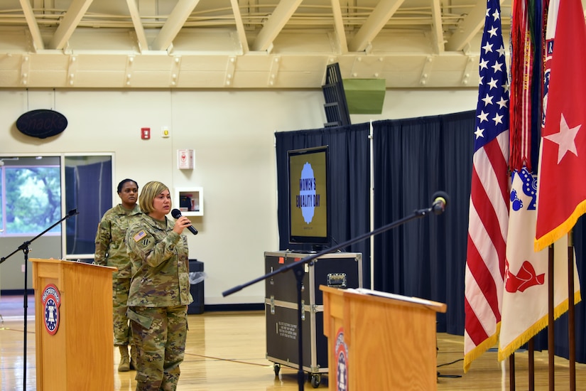 Maj. Patricia Cameron, U.S. Army Cadet Command, delivers her rendition of the National Anthem at the start of the Women's Equality Day Observance at Sadowski Center on Fort Knox, Kentucky, Aug. 23.