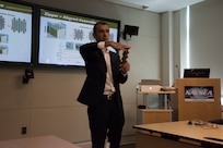 Dr. Evgueni Filipov demonstrates the simultaneous rigidity and flexibility of one of the origami examples he brought with him during his lecture “Using Origami to Make Deployable and Adaptable Structures at Multiple Scales at Naval Surface Warfare Center” at Naval Surface Warfare Center, Carderock Division on Aug. 21, 2019. Filipov is an assistant professor in the Department of Civil and Environmental Engineering at the University of Michigan. (U.S. Navy photo by Brooke Marquardt/Released)