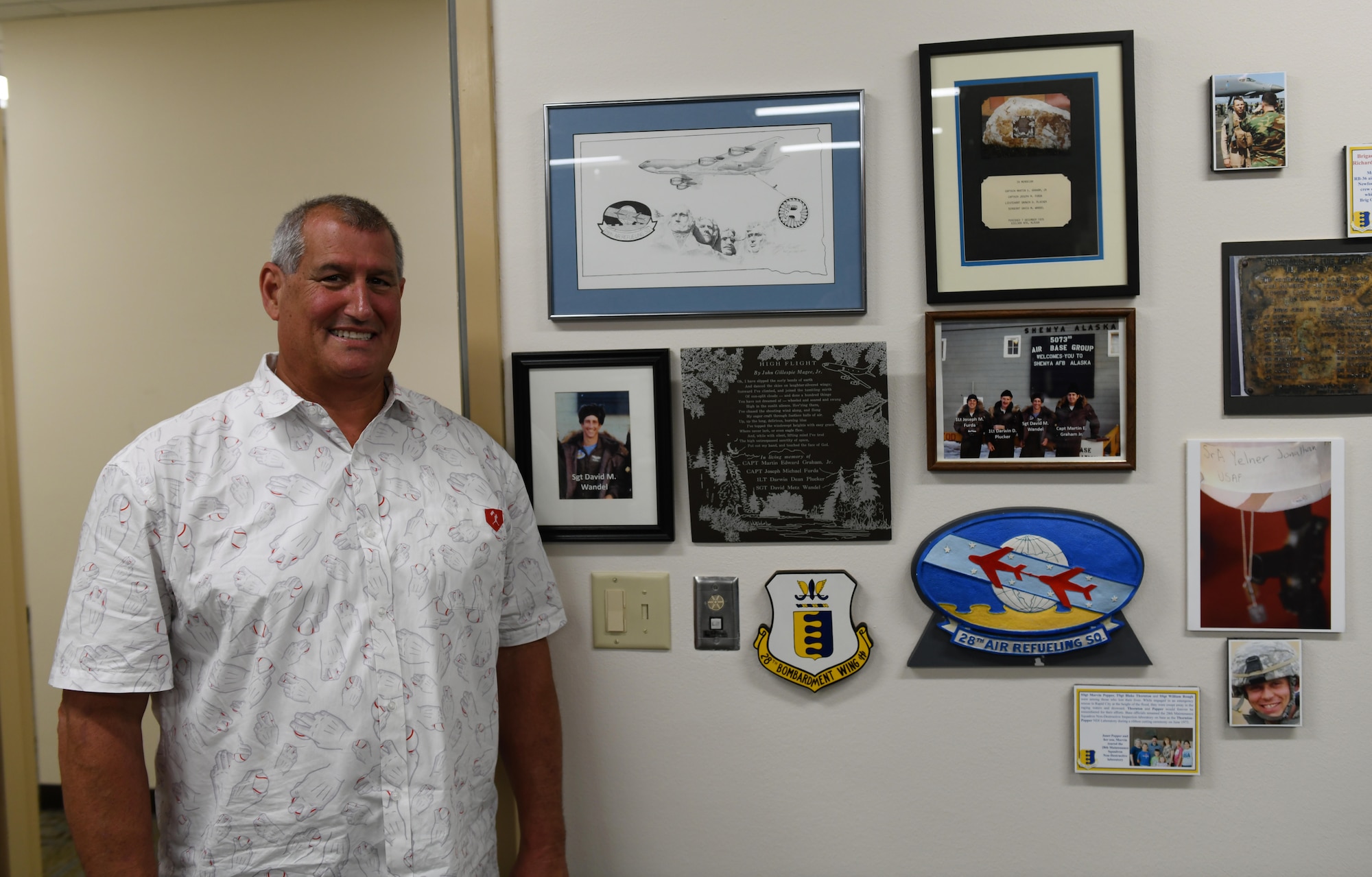 Jeff Wandel visits the memorial plaque that was dedicated to his brother, Sgt. David Wandel, a 28th Air Refueling Squadron boom operator, at the headquarters building on Ellsworth Air Force Base, S.D., July 30, 2019. After the 28th ARS was inactivated, the memorial was moved and Jeff spent several years trying to track it down. Eventually, the plaque was found in the South Dakota Air and Space Museum’s inventory. (U.S. Air Force photo by Airman 1st Class Christina Bennett)