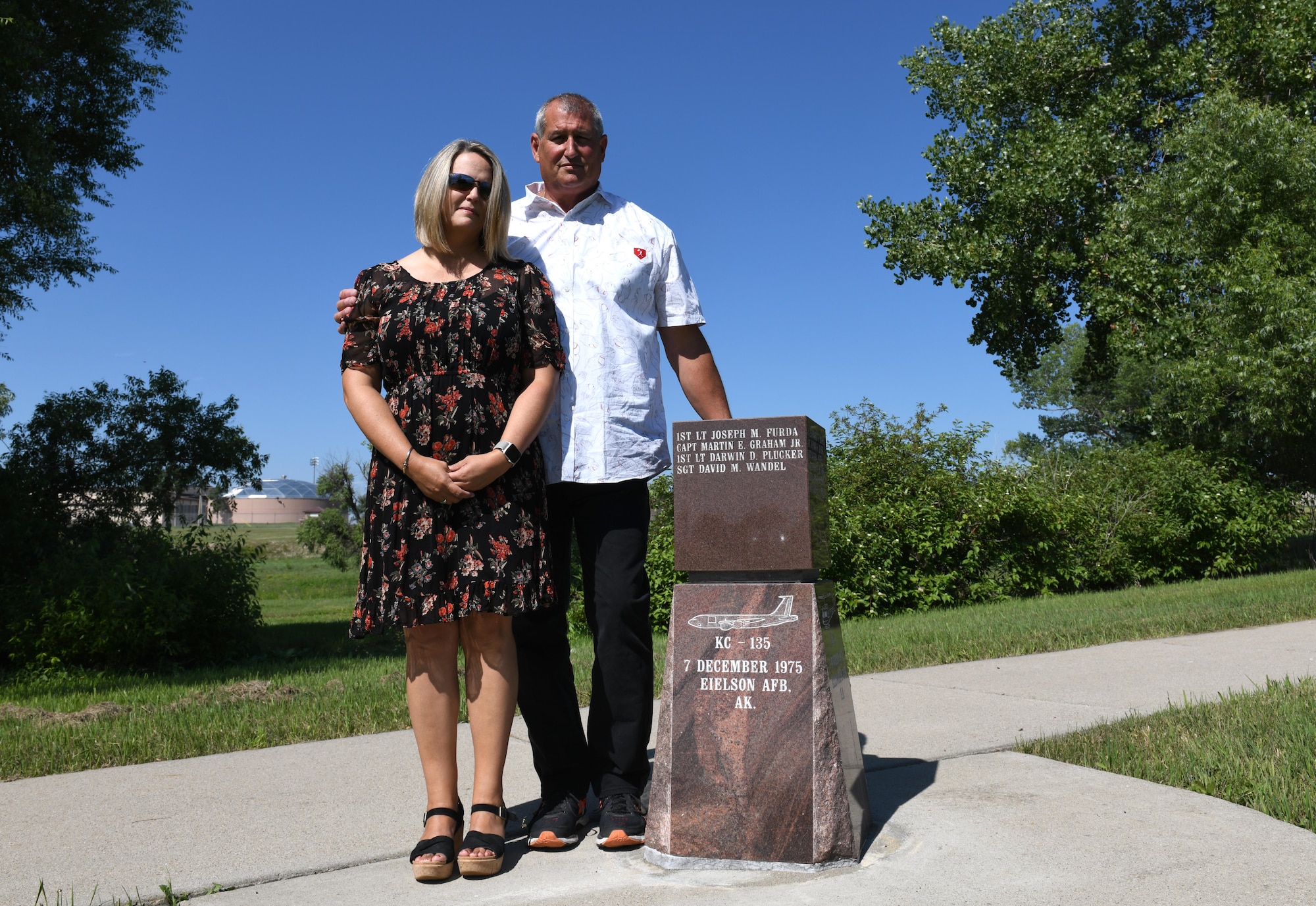 Jeff Wandel and his wife, Sandi, visit Ellsworth’s Memorial Park on Ellsworth Air Force Base, S.D., on July 30, 2019. In December 1975, Wandel and three of his fellow crewmembers – Capt. Martin E. Graham Jr., Capt. Joseph M. Furda and 1st Lt. Karwin M. Plucker – passed away in a plane crash just south of Eielson Air Force Base, Alaska. Wandel’s family spent several years searching for a memorial plaque dedicated to Wandel and his crew. (U.S. Air Force photo by Airman 1st Class Christina Bennett)
