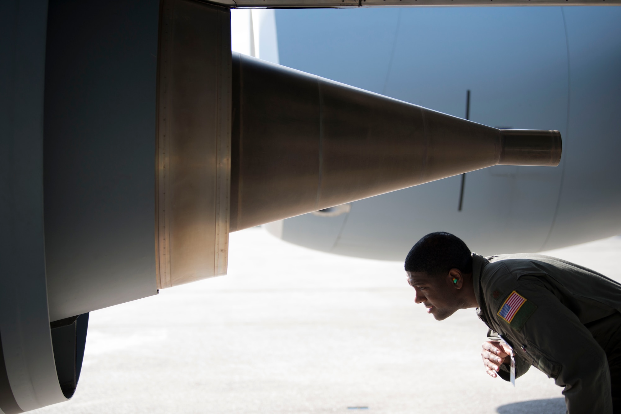 U.S. Air Force Maj. Dominique Willis, Deputy Chief of 6th Operations Group Standardization and Evaluation, inspects a KC-135 Stratotanker engine during a pre-flight check at MacDill Air Force Base, Fla., Aug. 21, 2019. Engines are inspected for any abnormalities prior to being started. (U.S. Air Force photo by Senior Airman Frank Rohrig)