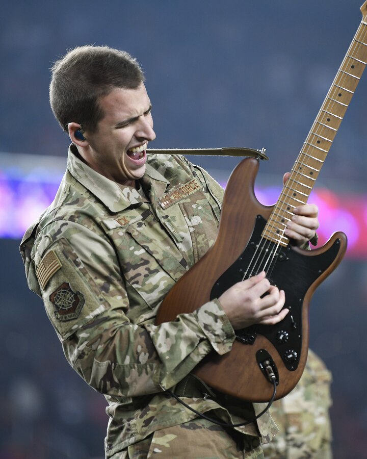 U.S. Air Force Airman 1st Class Michael Tuck, a guitarist with the U.S. Air Force Band of the Golden West, performs during halftime of the San Francisco Forty-Niners and New York Giants Monday Night Football game at Levi’s Stadium in Santa Clara, California, Nov. 12, 2018. The band performed in honor of Veterans Day and to support the National Football League’s Salute to Service Campaign. (U.S. Air Force photo by Louis Briscese)