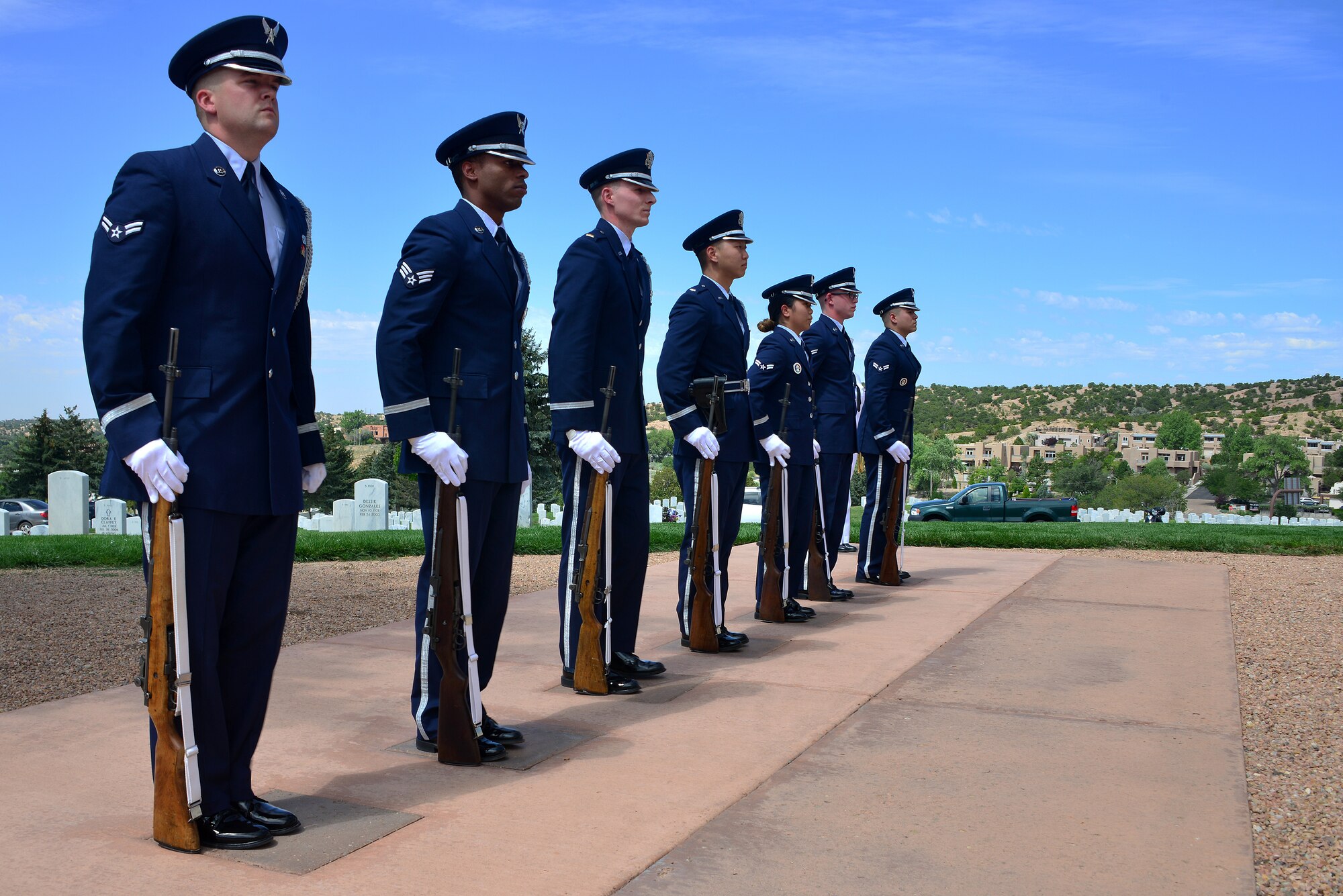Members of the Kirtland Air Force Base Honor Guard stand at attention during a funeral ceremony for U.S. Navy Fireman First Class Billy James Johnson at the Santa Fe National Cemetery in Santa Fe, N.M. Aug. 19, 2019. Johnson was amongst 429 crewmembers of the USS Oklahoma who lost their lives when the battleship came under surprise attack and completely sunk at Pearl Harbor Dec. 7, 1941. (U.S. Air Force photo by Airman 1st Class Austin J. Prisbrey)