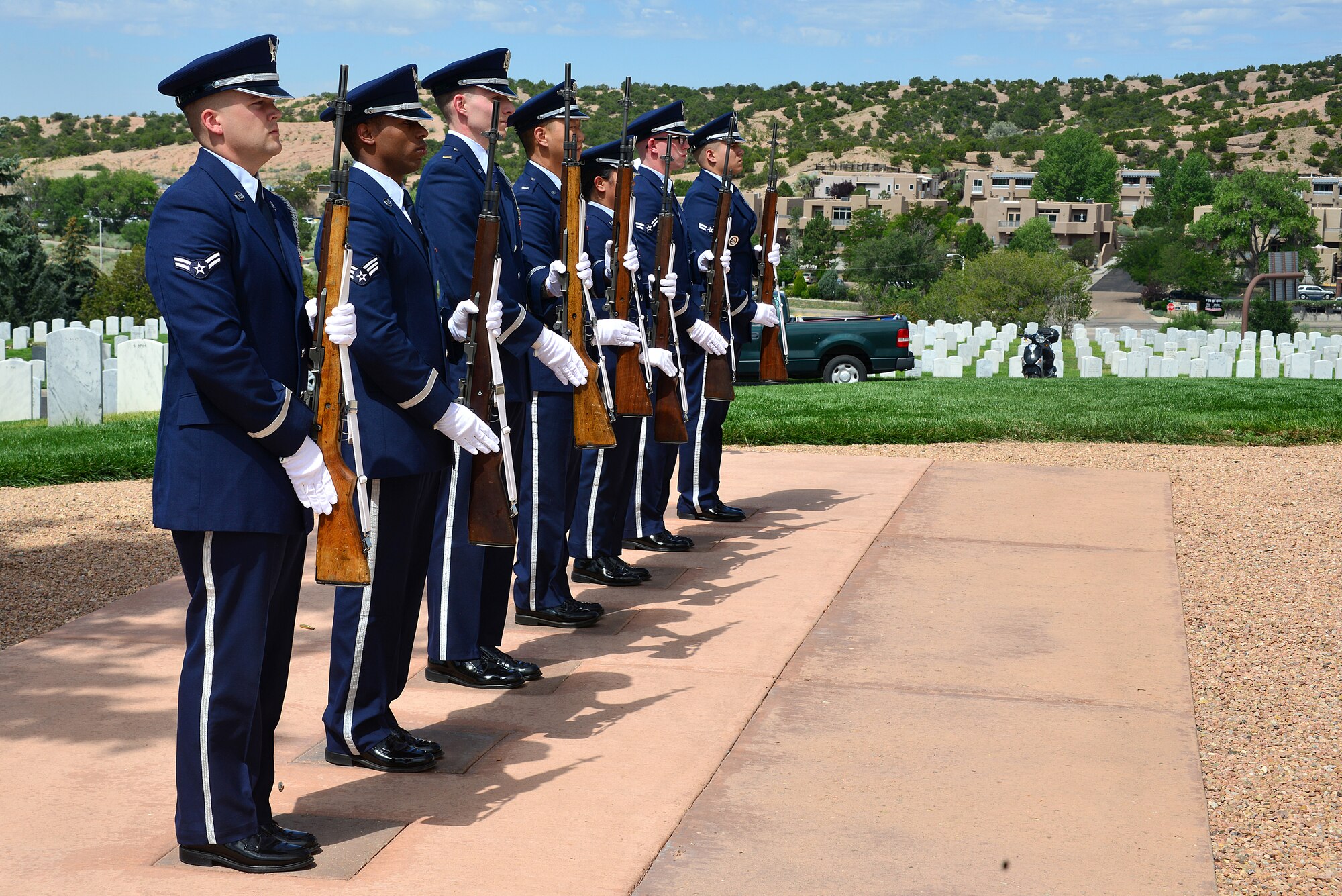Members of the Kirtland Air Force Base Honor Guard present arms at a funeral ceremony for U.S. Navy Fireman First Class Billy James Johnson at the Santa Fe National Cemetery in Santa Fe, N.M. Aug. 19, 2019. Technological advances with mitochondrial DNA allowed his primary next of kin to provide a DNA sample which lead to positive identification of Johnson. Of the 429 Sailors that lost their lives when the USS Oklahoma was sunk in the attack on Pearl Harbor, only 35 were later positively identified with this advance technology. (U.S. Air Force photo by Airman 1st Class Austin J. Prisbrey)