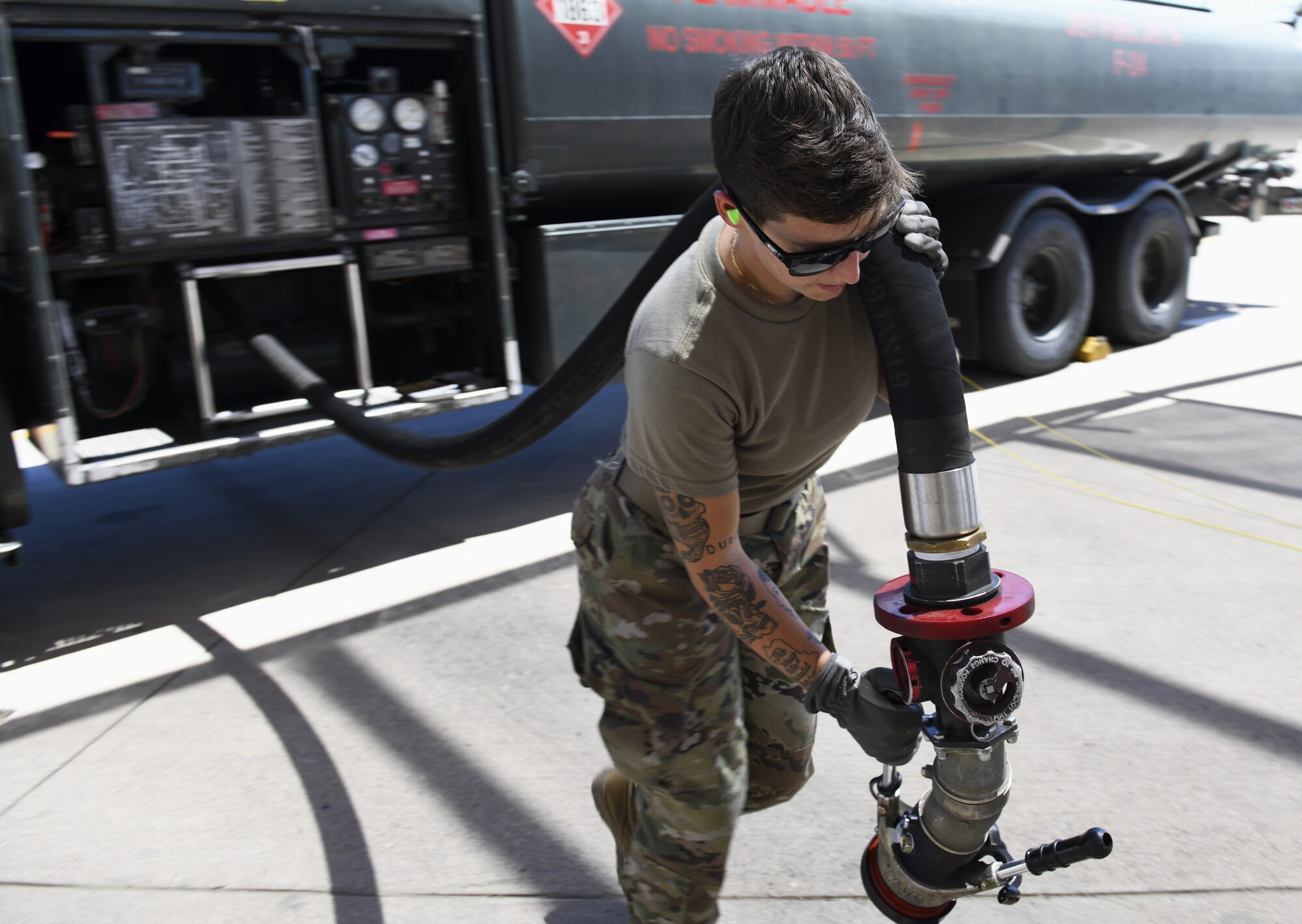 Airman 1st Class Katlynn Masnyk, 56th Logistics Readiness Squadron distribution fuels operator, pulls out a fuel hose to fuel an F-35A Lightning II Aug. 21, 2019, at Luke Air Force Base, Ariz.