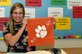 Tessa, key spouse for the 42nd Attack Squadron, poses for a photo at Betsy A. Rhodes Elementary School, in Las Vegas, Nevada, Aug. 15, 2019. Tessa is a full time teacher and mother of two. (U.S. Air Force photo by: Airman 1st Class William Rio Rosado)