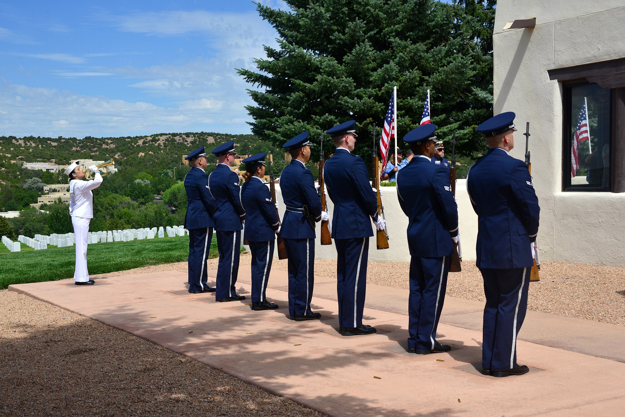 Members of the Kirtland Air Force Base Honor Guard present arms while U.S. Navy Information Specialist First Class Monica Lujan (left) Navy Operational Support Center Albuquerque, plays taps during a funeral ceremony for U.S. Navy Fireman First Class Billy James Johnson at the Santa Fe National Cemetery in Santa Fe, N.M. Aug. 19, 2019. Johnson was the son of William Gould Johnson and Zelah Adeline Dodson. He was one of eight children, born Nov. 24, 1919 in Caney, Ky. Johnson spent his teenage years in Chama, N.M. (U.S. Air Force photo by Airman 1st Class Austin J. Prisbrey)