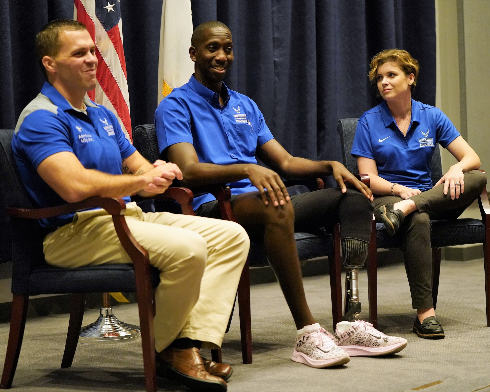 Three Air Force Wounded Warrior Program Ambassadors (pictured left to right), Master Sgt. (Ret.) Adam Boccher, Staff Sgt. Kevin Greene, and Maj. (Ret.) Emily Elmore, discuss their unique experiences on the road to recovery and resiliency during an event conducted at U.S. Transportation Command, Aug. 21.