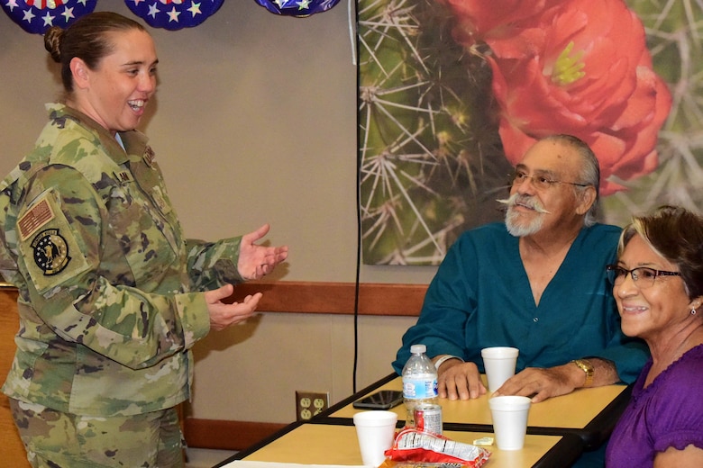 Female Airmen visits with Veterans at Tucson Veterans Administration Hospital