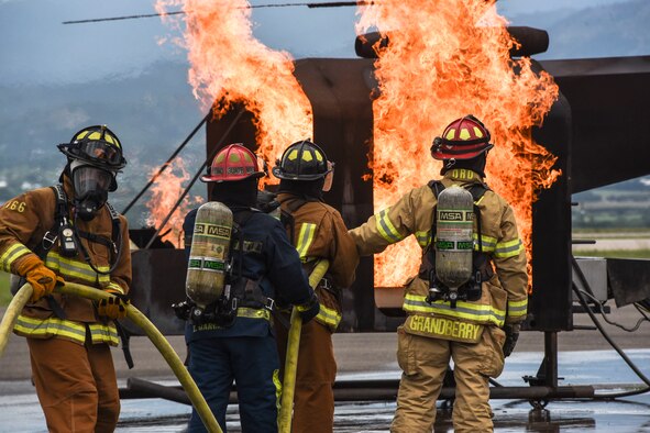 Firefighters from Joint Task Force-Bravo, 612th Air Squadron participated in aircraft-fire training with multinational partners at Soto Cano Air Base, Honduras, Aug. 21, 2019, during Central America Sharing Mutual Operational Knowledge and Experiences (CENTAM SMOKE). Twenty five firefighters from Honduras, Guatemala, El Salvador, Belize, Costa Rica and JTF-Bravo trained together through various events in the biannual exercise held Aug. 19-23. (U.S. Army photo by Maria Pinel)