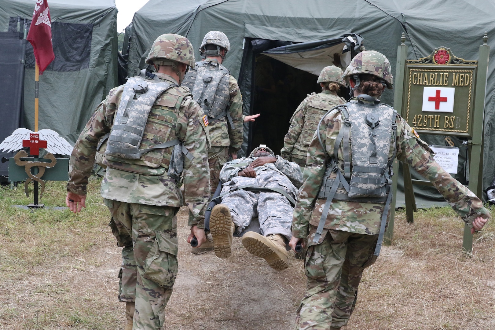 Virginia National Guard Soldiers assigned to the Charlottesville-based Charlie Company, 429th Brigade Support Battalion, 116th Infantry Regiment, 116th Infantry Brigade Combat Team conduct a mass casualty exercise using personnel with simulated injuries July 17, 2019, during eXportable Combat Training Capability Rotation 19-4 at Fort Pickett, Virginia.