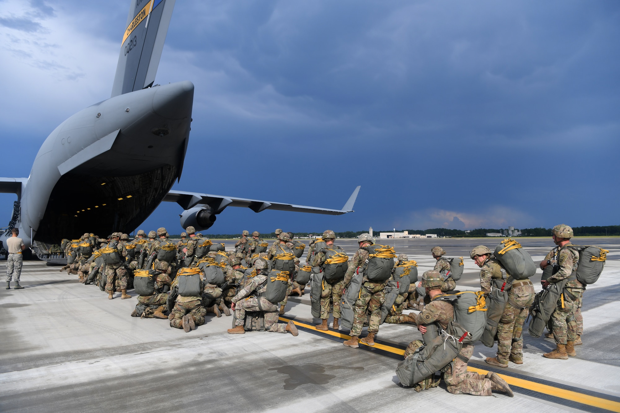 Paratroopers assigned to the 82nd Airborne Division board a Joint Base Charleston C-17 Globemaster III before performing a parachute assault exercise during Battalion Mobility Tactical Week at Fort Bragg, N.C., Aug. 19, 2019. Battalion Mass Tactical Week is a joint exercise involving the U.S. Air Force and the U.S. Army designed to enhance service members’ abilities by practicing contingency operations in a controlled environment. The exercise incorporated three C-130J Super Hercules assigned to Little Rock Air Force Base, Arkansas, three C-17 Globemaster IIIs assigned to Joint Base Charleston, S.C. and Army paratroopers assigned to the 82nd Airborne Division of Fort Bragg, N.C. The exercise allowed all parties to quickly and safely complete training tasks, such as personnel and cargo air drops, to prepare joint forces to operate during global mobility missions.