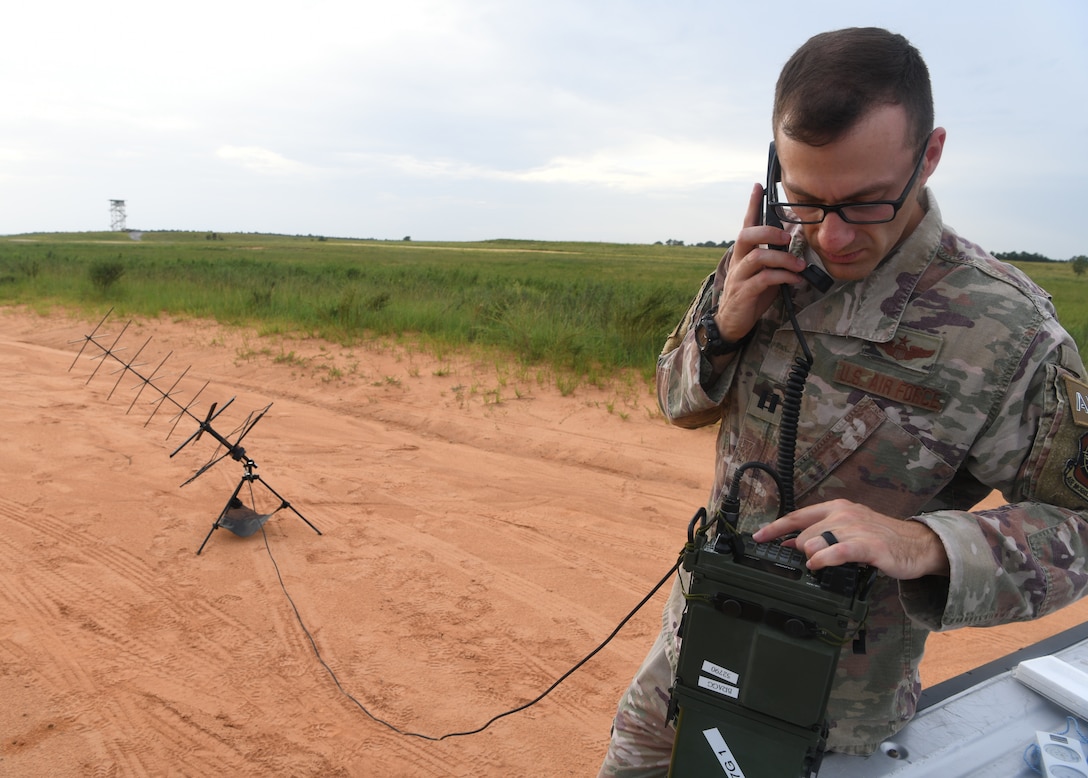 U.S. Air Force Capt. Peter Callo, an air mobility liaison officer assigned to the 621st Mobility Support Operations Squadron from Joint Base McGuire-Dix-Lakehurst, N.J., inspects communications equipment during Battalion Mobility Tactical Week at Fort Bragg, N.C., Aug. 20, 2019. Battalion Mass Tactical Week is a joint exercise involving the U.S. Air Force and the U.S. Army designed to enhance service members’ abilities by practicing contingency operations in a controlled environment. The exercise incorporated three C-130J Super Hercules assigned to Little Rock Air Force Base, Arkansas, three C-17 Globemaster IIIs assigned to Joint Base Charleston, S.C. and Army paratroopers assigned to the 82nd Airborne Division of Fort Bragg, N.C. The exercise allowed all parties to quickly and safely complete training tasks, such as personnel and cargo air drops, to prepare joint forces to operate during global mobility missions.