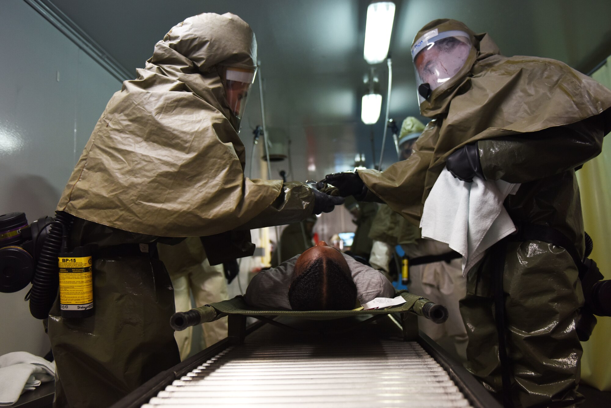 Airmen assigned to the 39th Medical Group practice decontamination procedures on a simulated victim during an exercise Aug. 21, 2019, at Incirlik Air Base, Turkey. The 39th Air Base Wing conducted a base-wide exercise to assess the emergency readiness of Airmen on the installation. (U.S. Air Force photo by Staff Sgt. Joshua Magbanua)