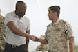 U.S. Army Lt. Col. Omar Minott, left, the commander of 1st Squadron, 102nd Cavalry Regiment, 44th Infantry Brigade Combat Team, New Jersey Army National Guard, shakes hands with Jordanian Armed Forces Lt. Col. Saif Al Khawaldeh, the commander of the 39th Mechanized Infantry Battalion, prior to a planning meeting for Exercise Eager Lion 19 in Jordan on Aug. 19, 2019. This multinational exercise is U.S. Central Command’s premiere exercise in the Levant region and is a major training event that provides U.S. forces, Jordan Armed Forces and 28 other participating nations the opportunity to improve their collective ability to plan and operate in a coalition-type environment.